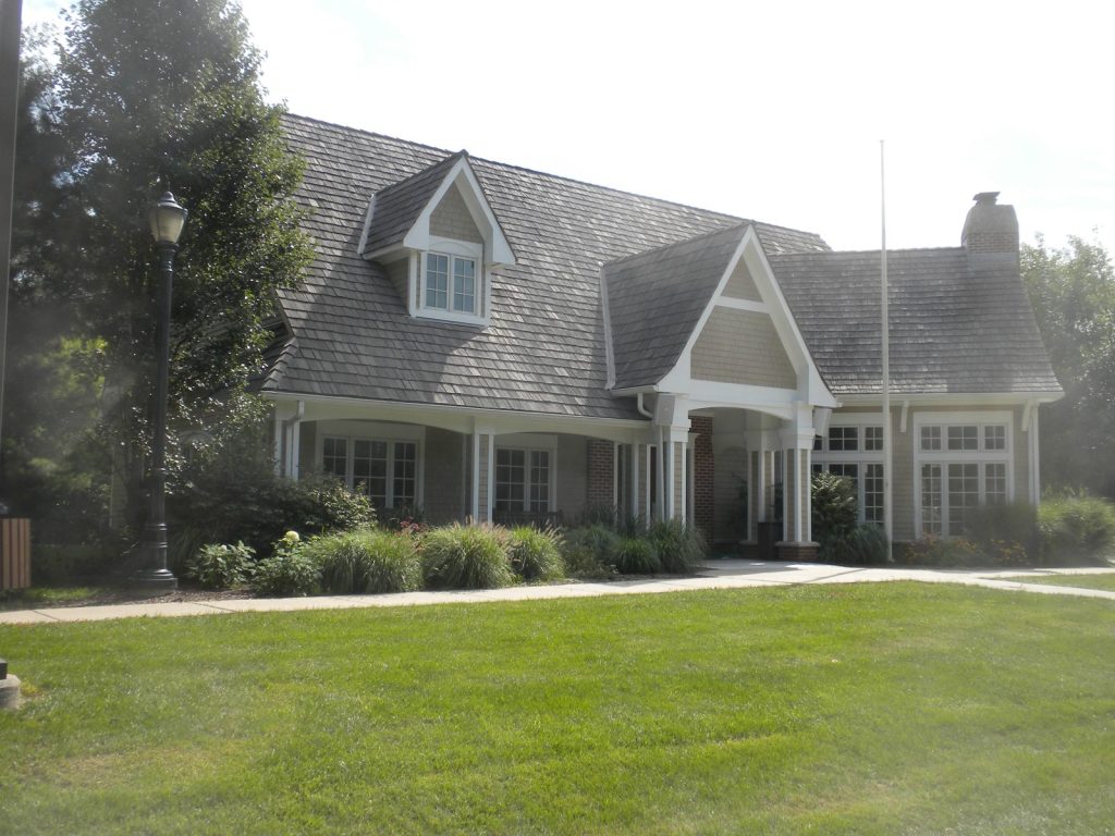 Shingle-style clubhouse exterior painted by Pete the Painter