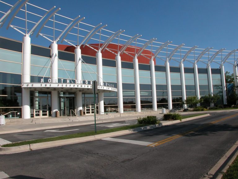 Multi-story commercial office building with white columns painted by Pete the Painter