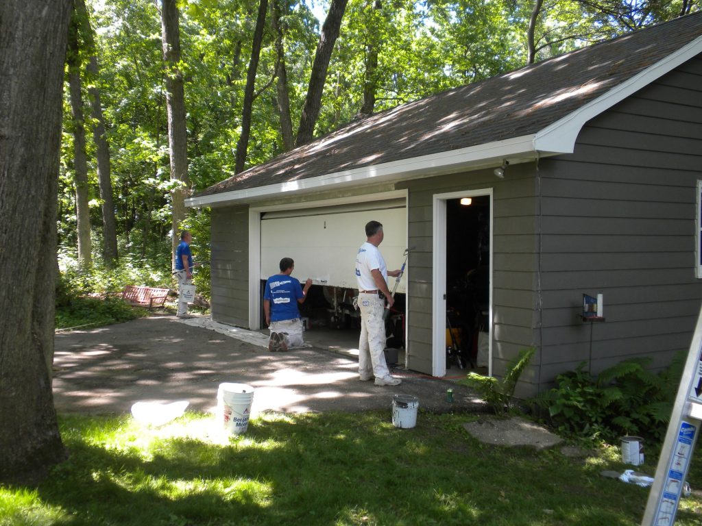 Crew painting the detached garage at the Green Lake lake house