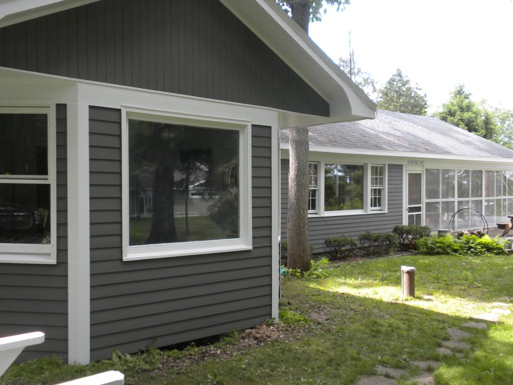 Green Lake lake house after painting: new gray siding with white trim, bay window
