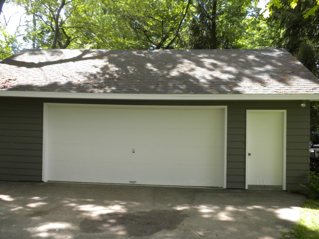 Green Lake lake house after painting: new gray siding with white trim, garage