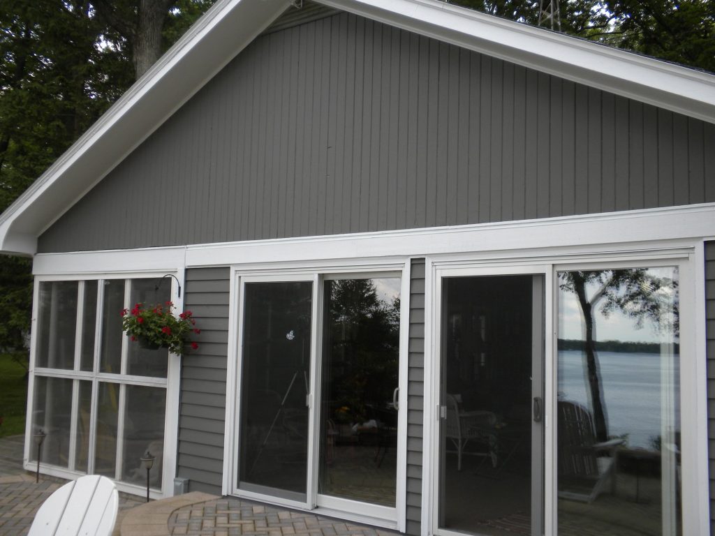 Green Lake lake house after painting: new gray siding with white trim, screened porch