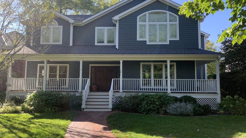 Full exterior repaint, two-story home with wraparound porch