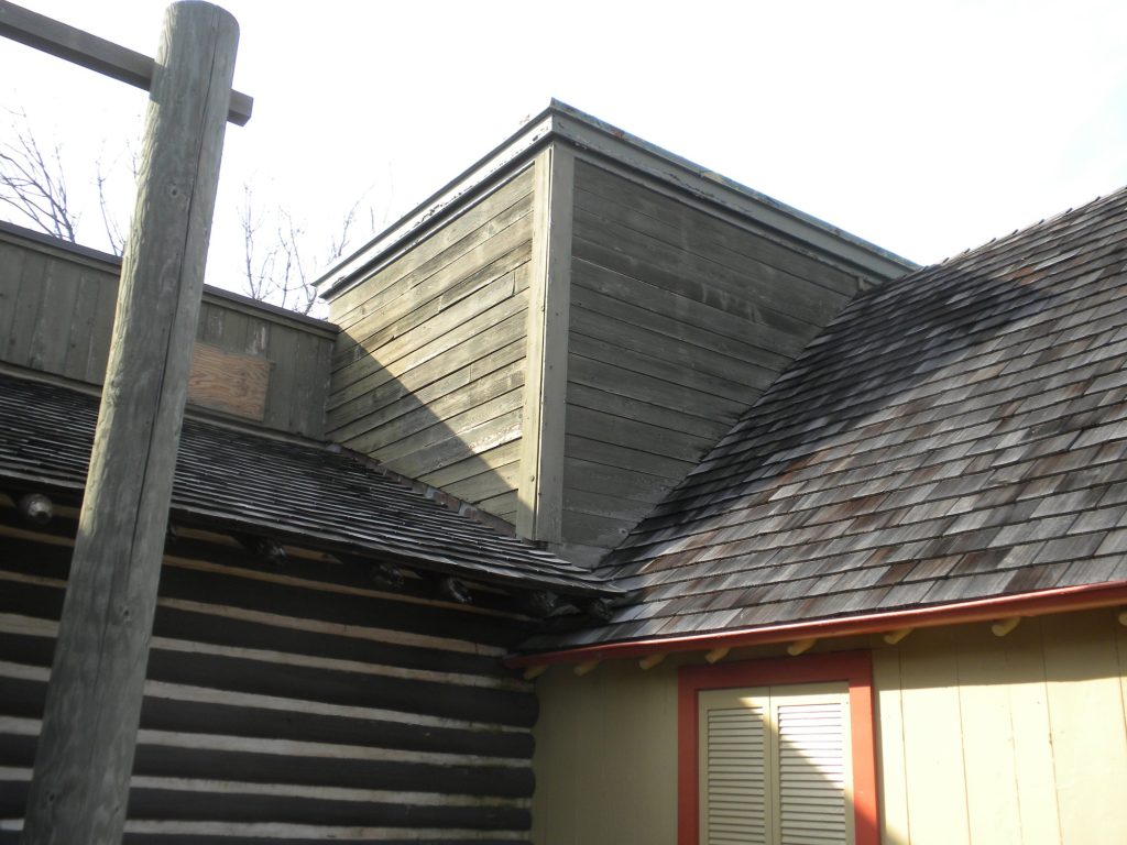 Red-trimmed frontier building at Six Flags Great America after painting