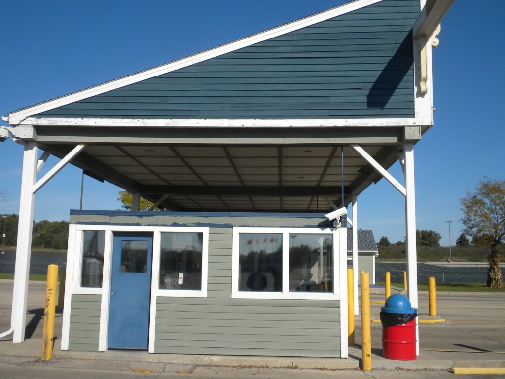 Front of a repainted toll booth at the Six Flags Hurricane Harbor entrance