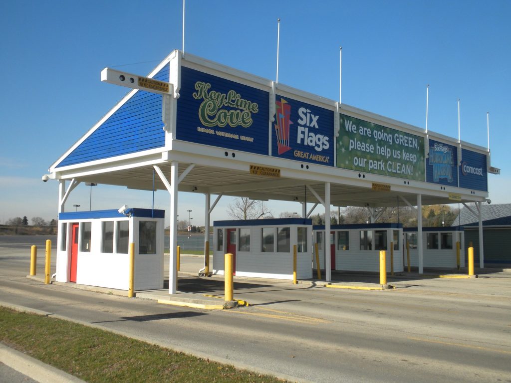 Six Flags Hurricane Harbor parking entrance with repainted booths and signage frame